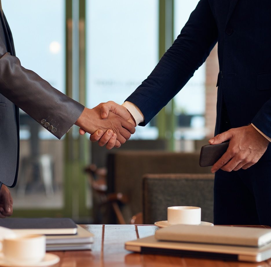 Cropped image of business people shaking hands before meeting
